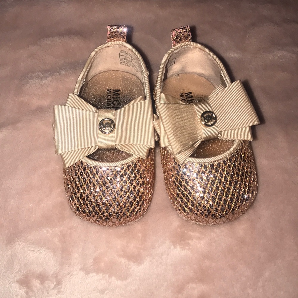 Gold dress shoes for a 6-9 month old baby girl.